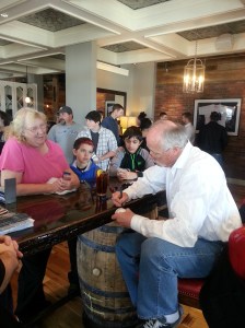 Hall of Fame pitcher Rich "Goose" Gossage signs autographs for fans at Bourbon Brothers on Sat. Feb. 8, 2014.